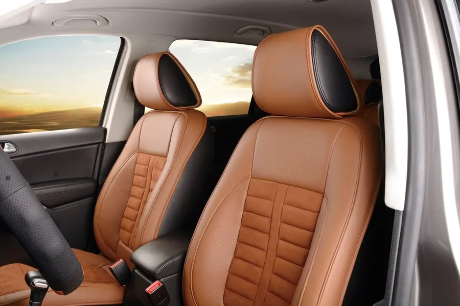Heated front seat glowing warm inside a dark car interior