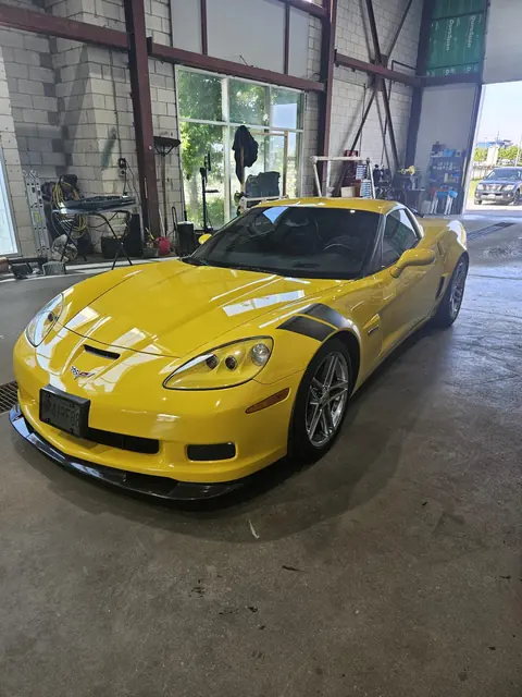 Yellow Corvette parked inside the Eastman shop